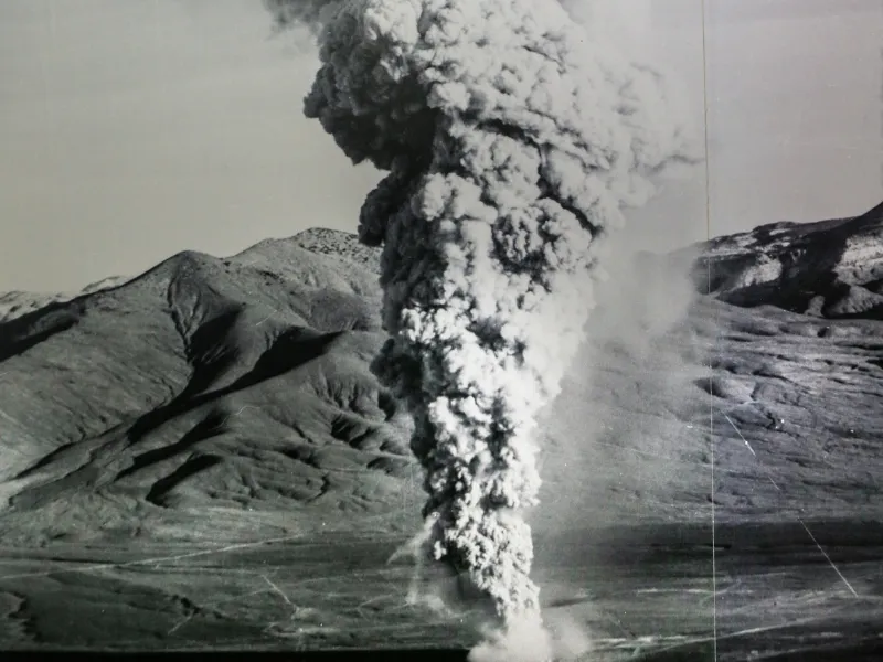 Historical photo of an atmospheric nuclear test explosion forming a mushroom cloud.